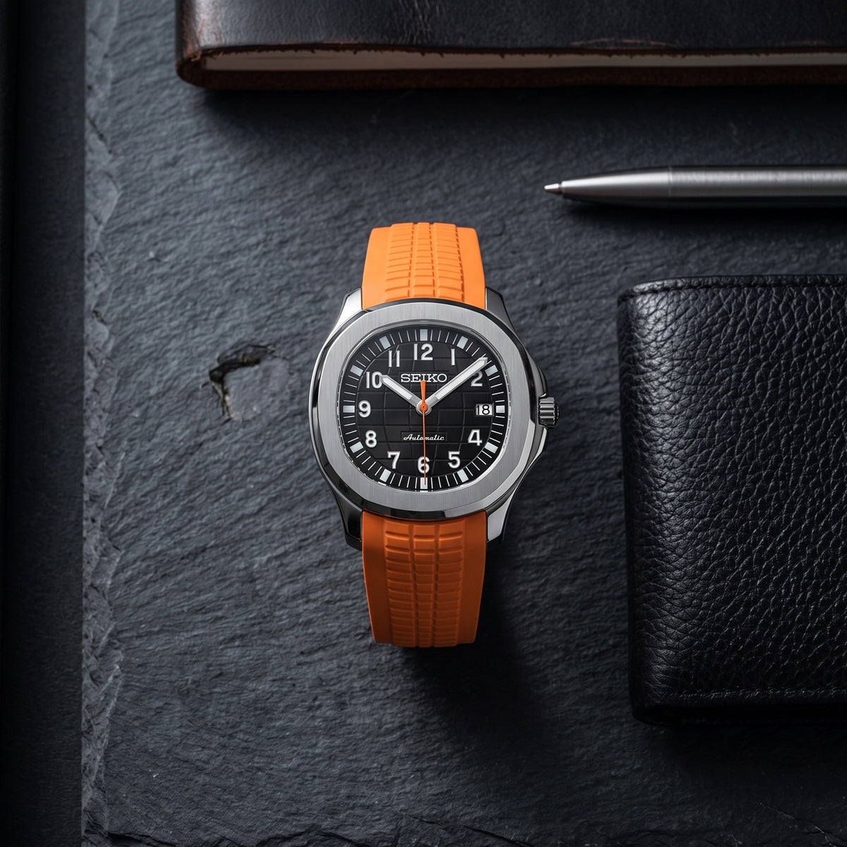 Aqua Mod – Black Dial Orange Accent – 41mm – Automatic – lifestyle flat lay