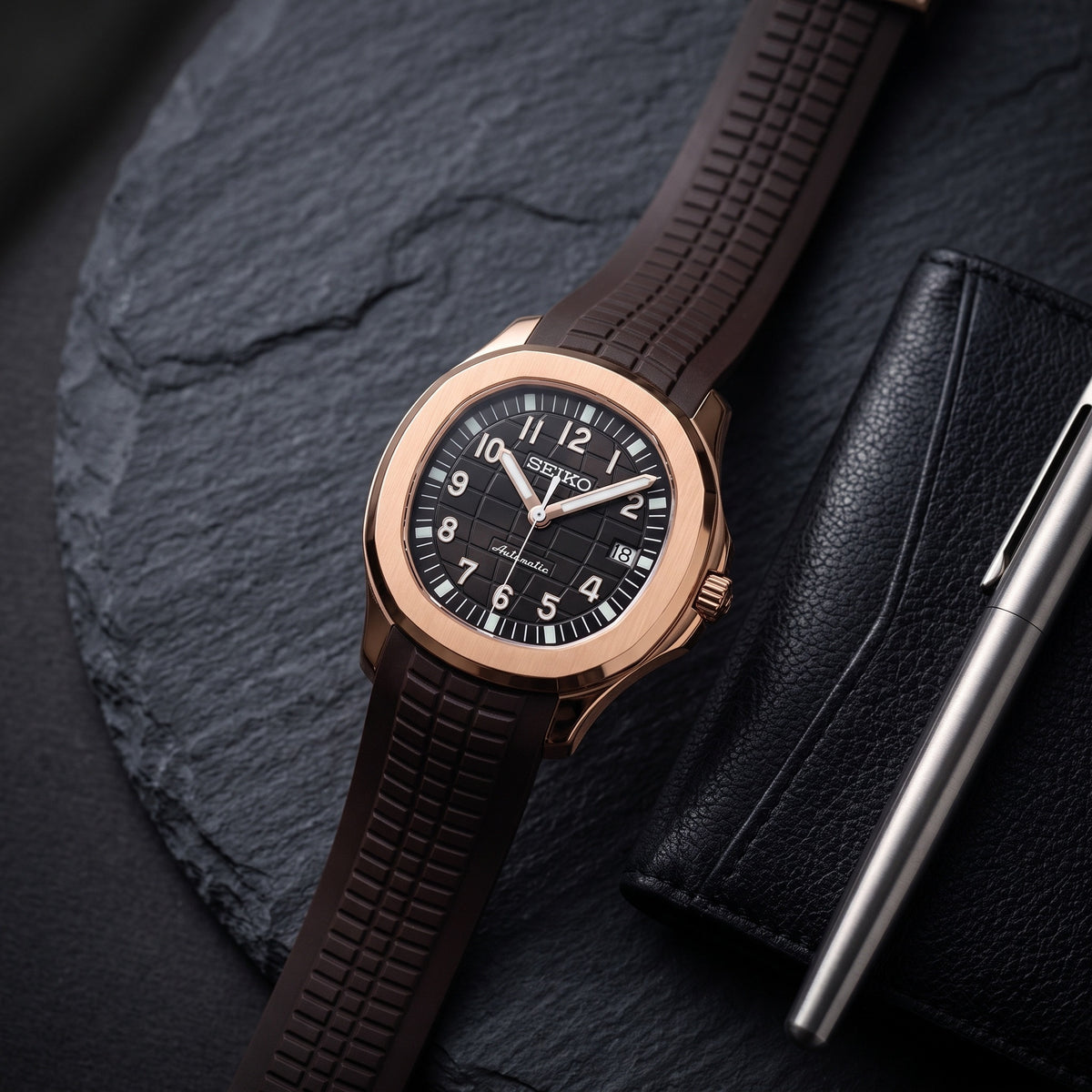 Aqua Mod – Rose Gold Black Dial – 41mm – Automatic – lifestyle flat lay