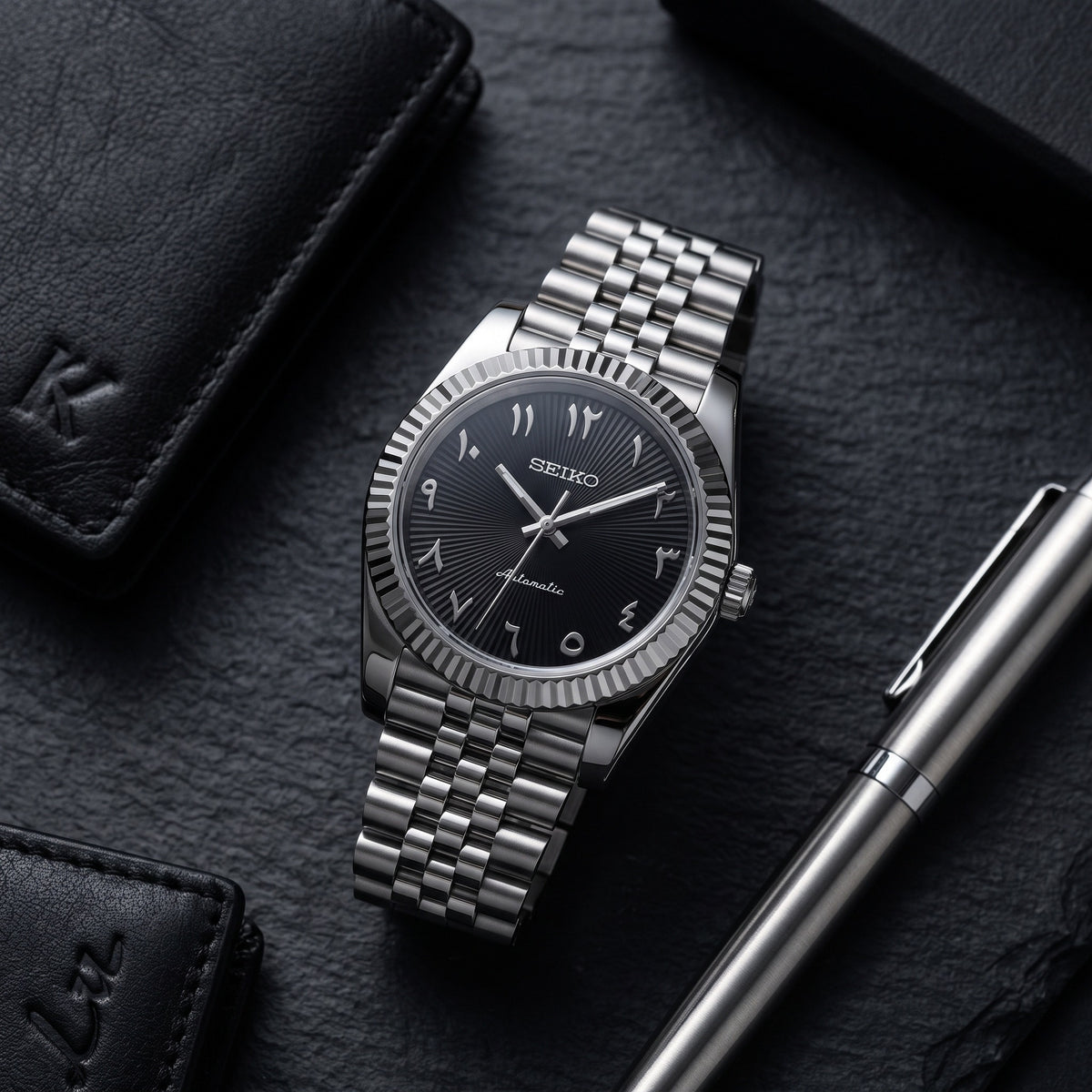 Date Mod – Steel · Black-Green Arabic Dial – Automatic – lifestyle flat lay