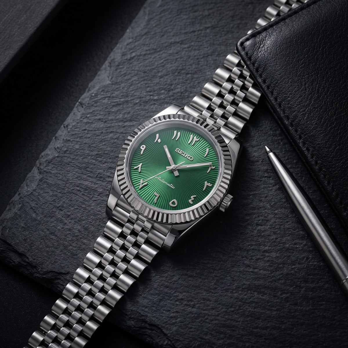 Date Mod – Steel · Green Arabic Dial III – Automatic – lifestyle flat lay