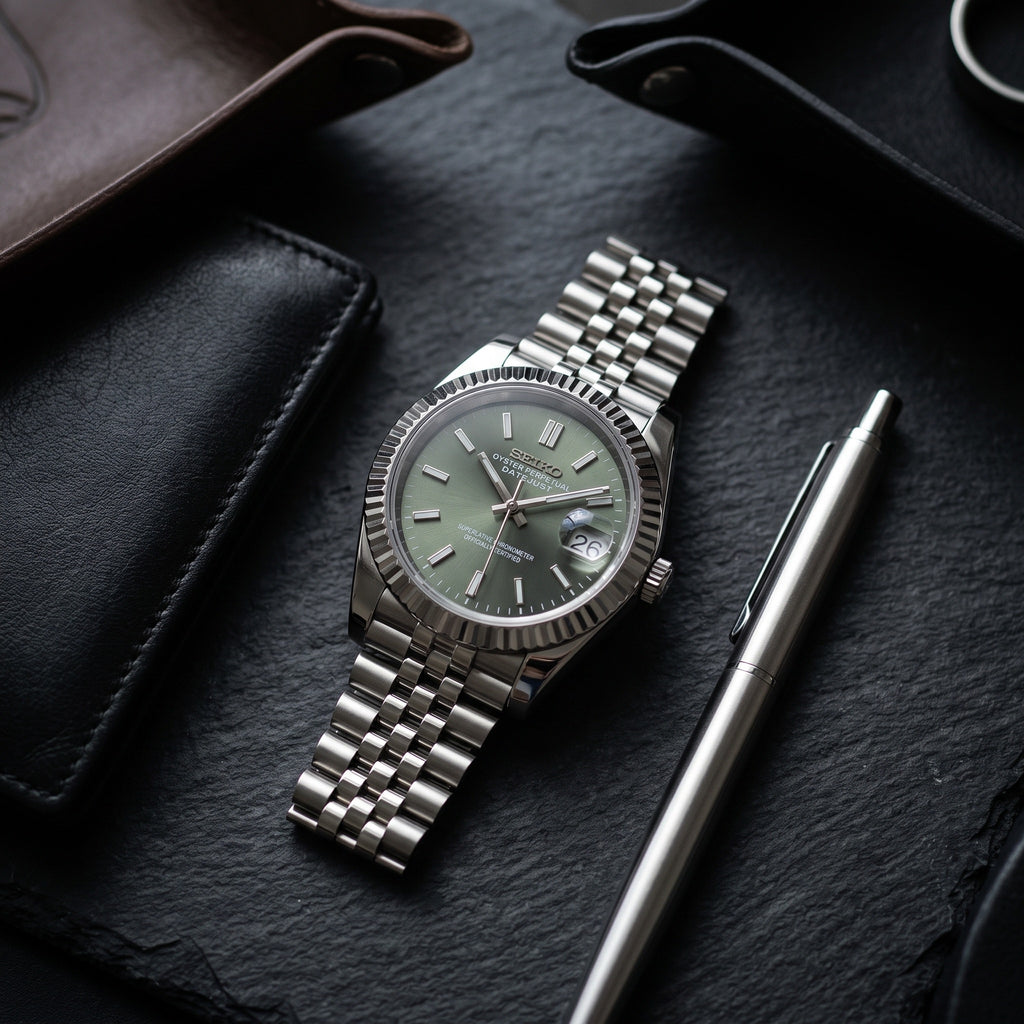 Date Mod – Steel · Green Sunburst Dial – Automatic – lifestyle flat lay