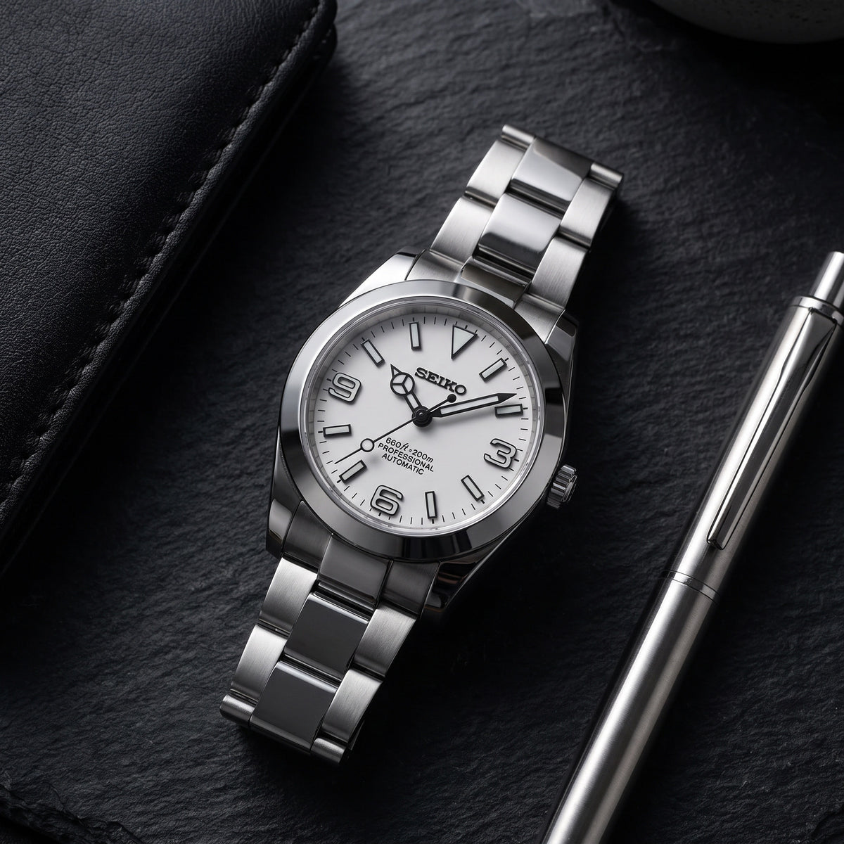 Date Mod – Steel · Silver Explorer Dial – Automatic – lifestyle flat lay