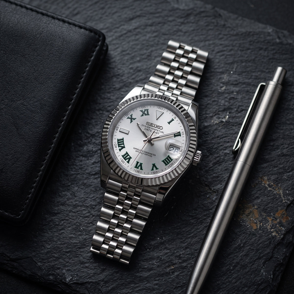 Date Mod – Steel · Silver Green-Roman Dial – Automatic – lifestyle flat lay