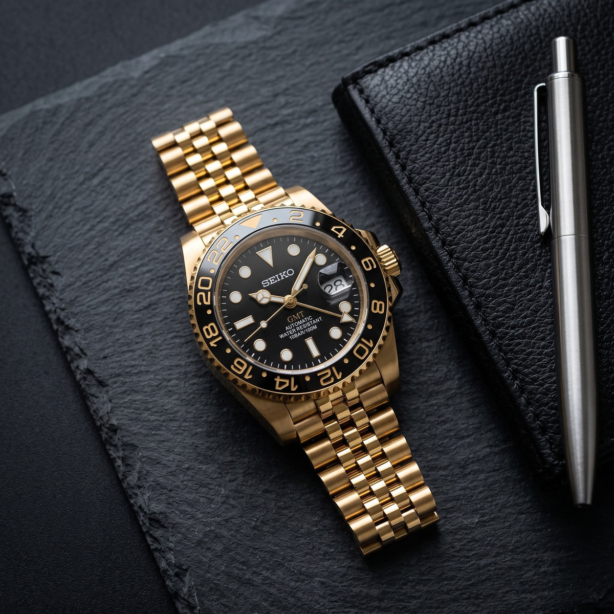 GMT Mod – Full Gold · Black Bezel – 40mm – Automatic GMT – lifestyle flat lay