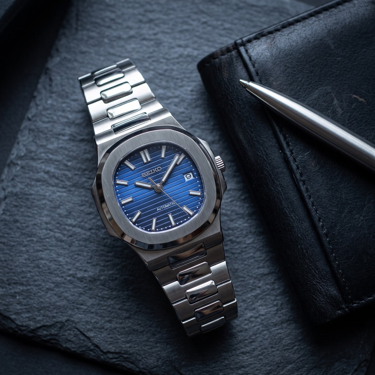 Naut Mod – Steel · Royal Blue Dial – 41mm – Automatic – lifestyle flat lay