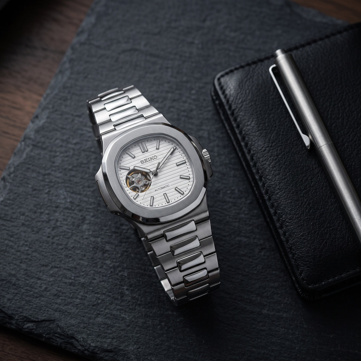 Naut Mod – Steel · White Open-Heart Dial – 41mm – Automatic – lifestyle flat lay