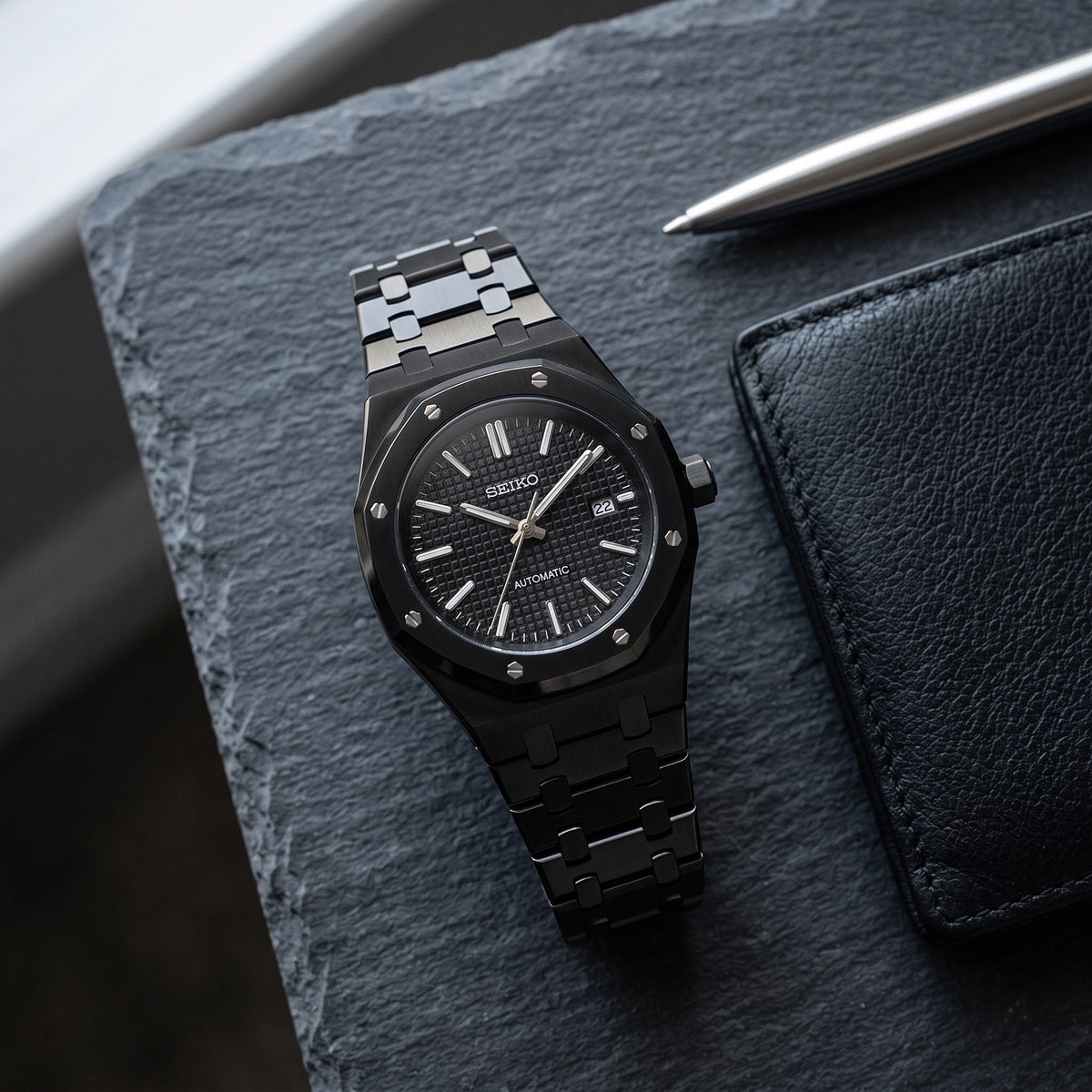 Oak Mod – Black PVD · Black Dial – 41mm – Automatic – lifestyle flat lay